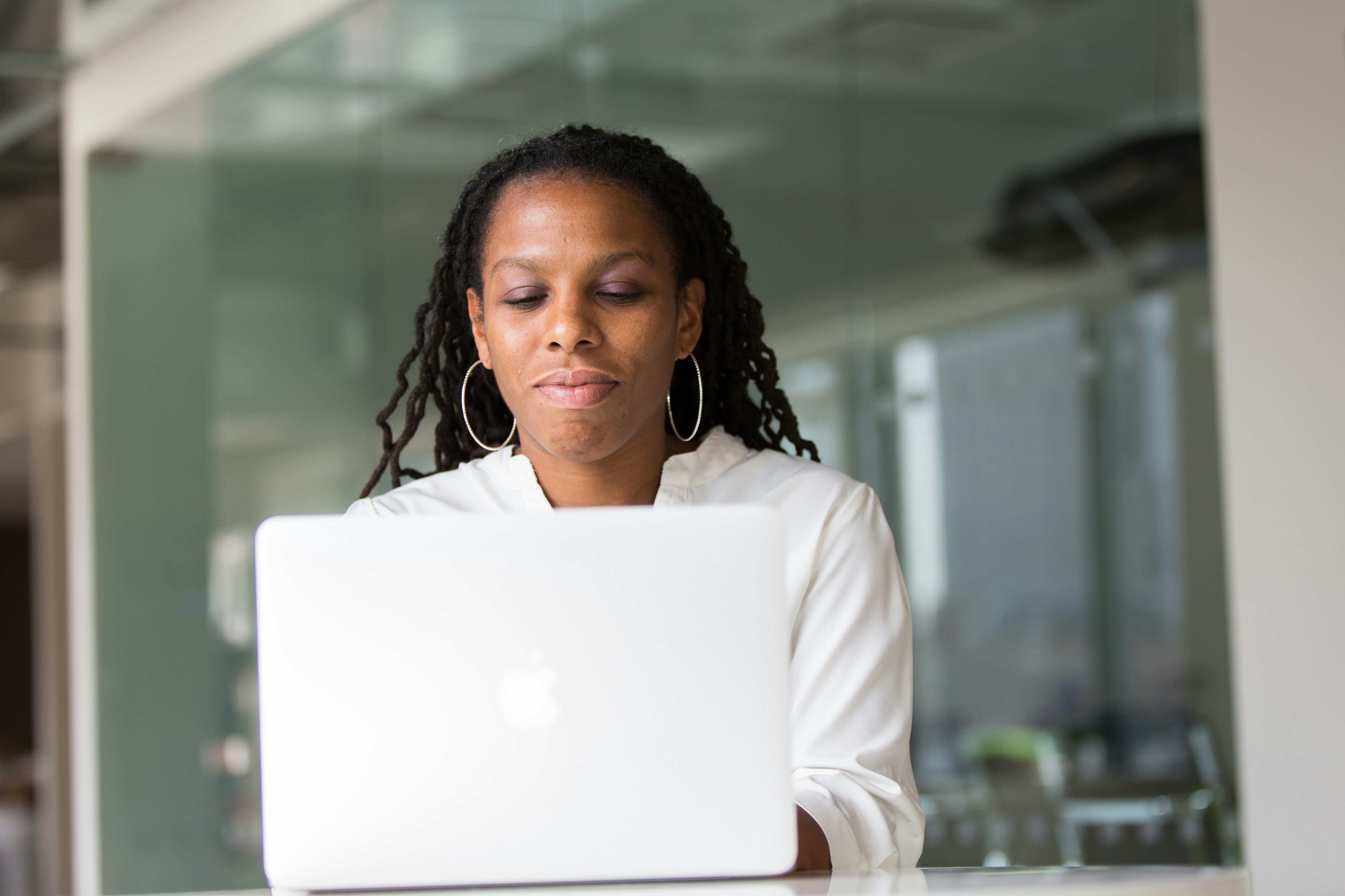 woman typing at her laptop